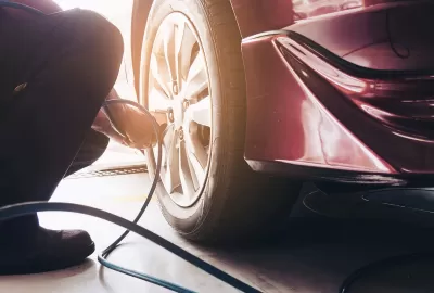 man showing how to put air in tyres